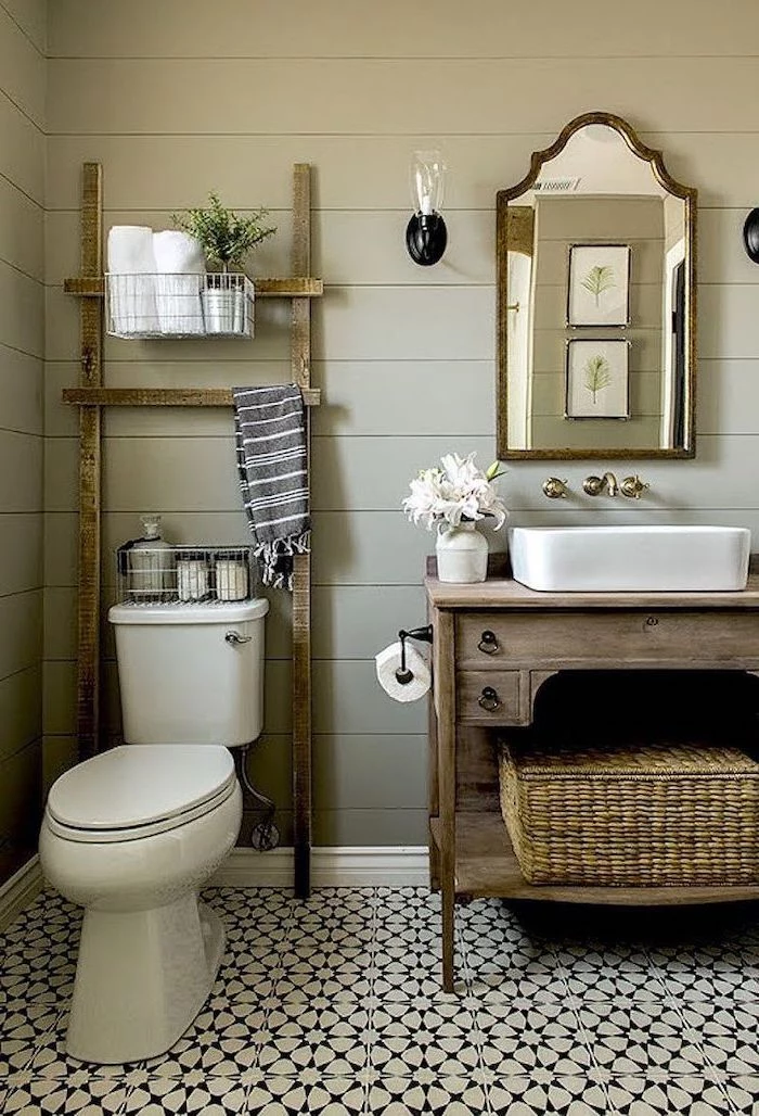 white and black printed floral tiles on the floor country bahtoom ideas gray shiplap on the walls wooden vanity