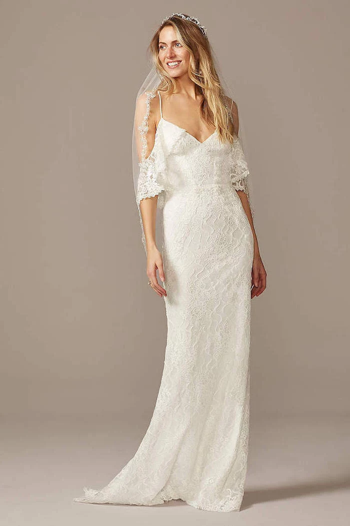woman wearing white lacy dress bohemian style wedding dresses with medium length wavy blonde hair