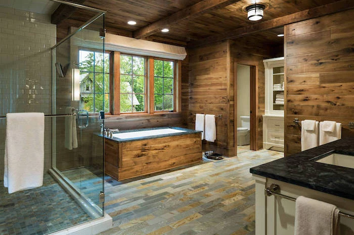 wood on the walls stone tiles on the floor farmhouse bathroom ideas exposed wood beams on the ceiling separate shower with white subway tiles