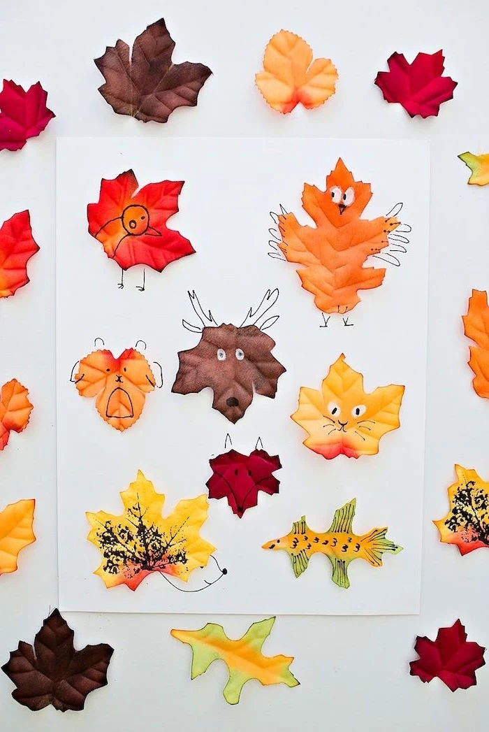 activities for kids at home white background lots of fall leaves in brown orange and yellow made as animals