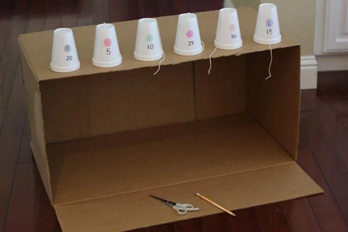 art and craft ideas for kids large carton box six styrofoam cups placed on top with numbers scissors and pencil