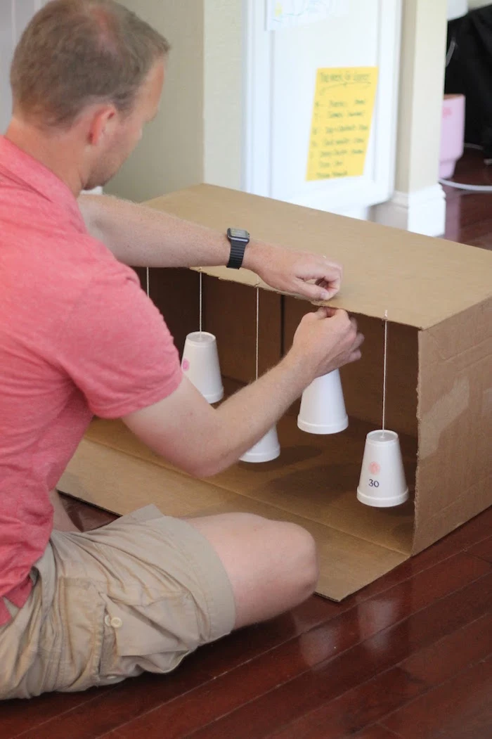 attaching the styrofoam cups to the box art and craft ideas for kids target practice for kids