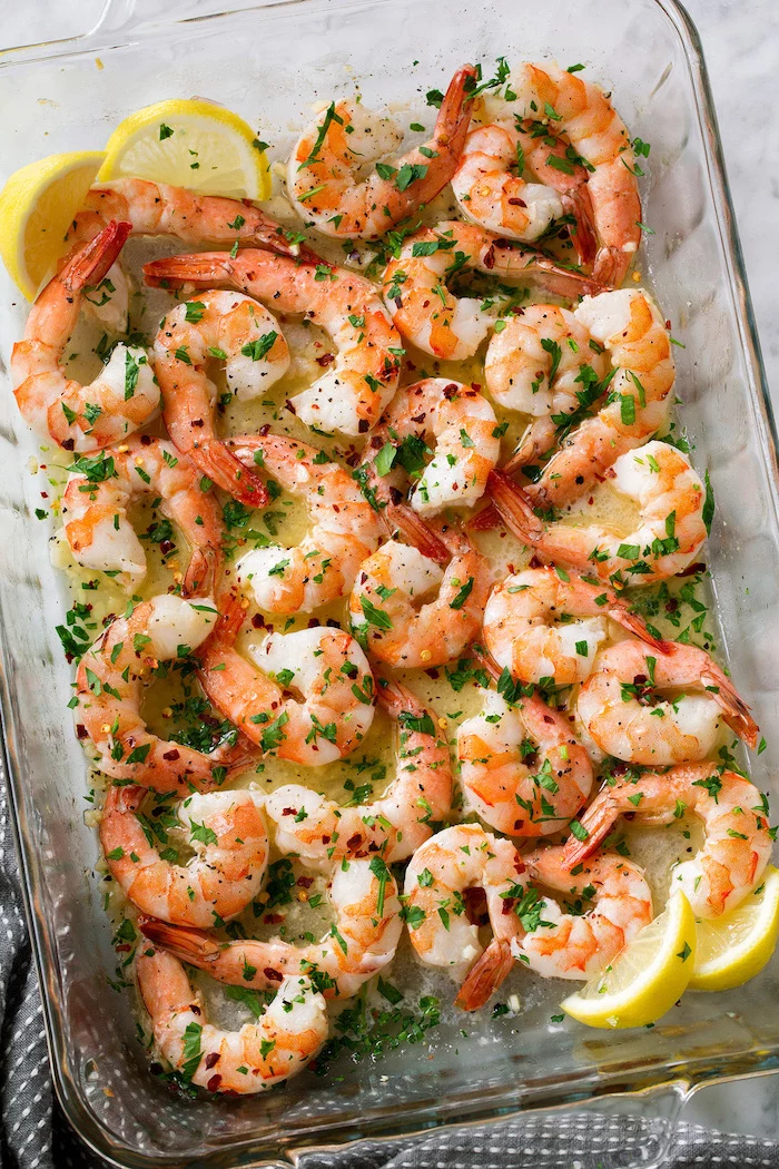 baked shrimp in lime sauce garnished with chopped parsley shrimp recipes inside glass casserole dish