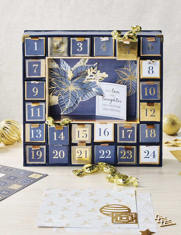 blue and gold carton boxes decorated with numbers unique advent calendars candy inside them