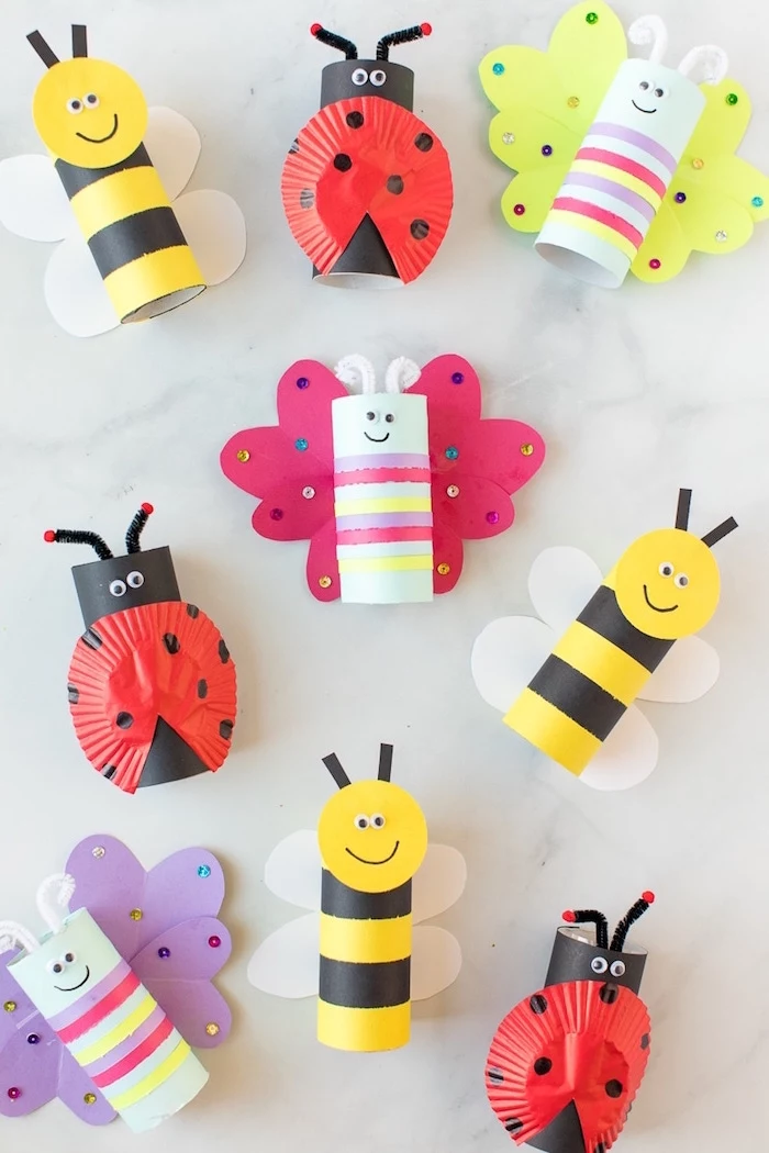 butterflies bees and lady bugs made out of toilet paper rolls and crepe paper indoor activities for kids white background