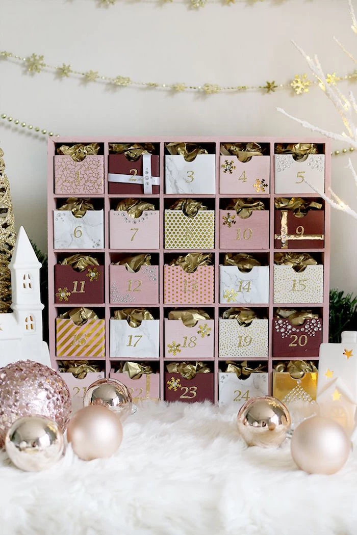 calendar in rose gold diy advent calendar ideas with small wooden boxes filled with candy and gold paper