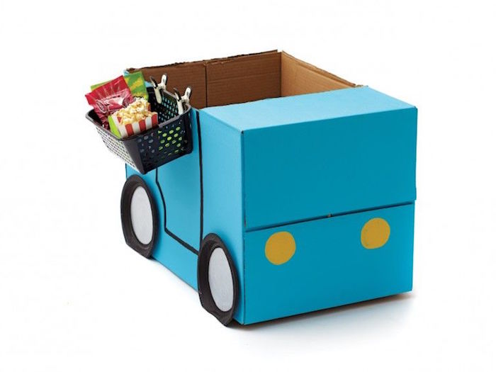 car made out of box painted in blue with paper plates for wheels craft ideas for kids basket with candy attached to the side
