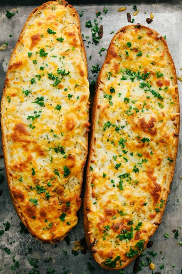 christmas ham dinner two large slices of bread covered with cheese baked on baking sheet garnished with parsley