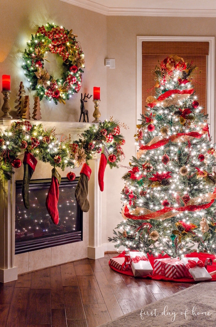 christmas tree ideas 2020 lots of led lights on tree with red ribbon presents underneath placed next to fireplace