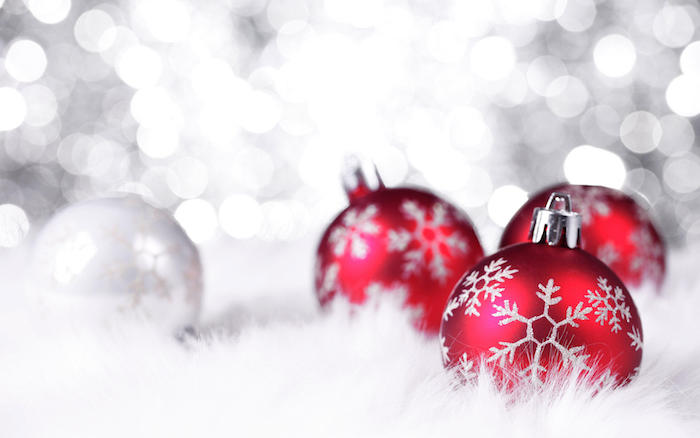 christmas wallpaper iphone close up photo of three red baubles with snowflakes photographed on white background