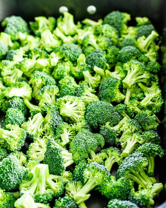 close up photo of lots of broccoli arranged in baking dish what to make on thanksgiving