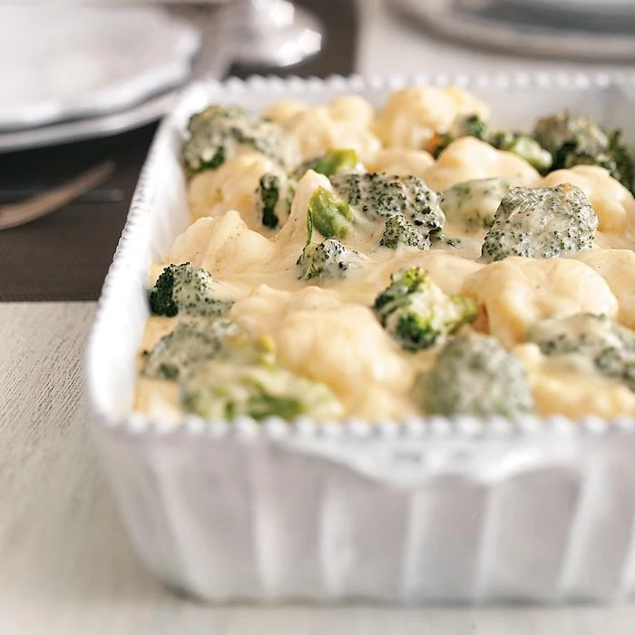 creamy broccoli thanksgiving side dishes 2020 baked inside white casserole dish placed on the table