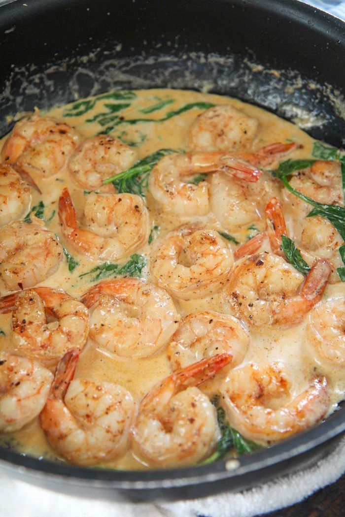 creamy garlic butter shrimp with spinach how long to cook shrimp cooked inside black saucepan