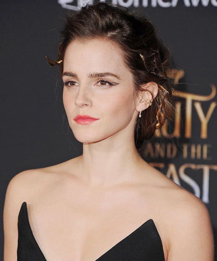 emma watson on the red carpet wearing black strapless dress eyeliner for hooded eyes hair in low messy updo