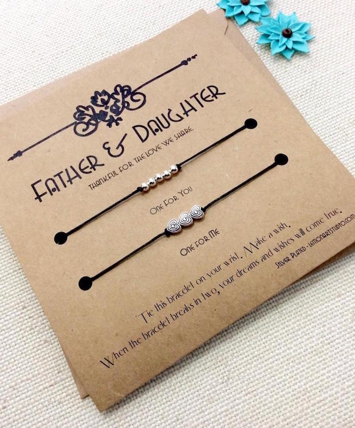 father and daughter bracelets good gifts for dad placed on carton with personal quote written on it