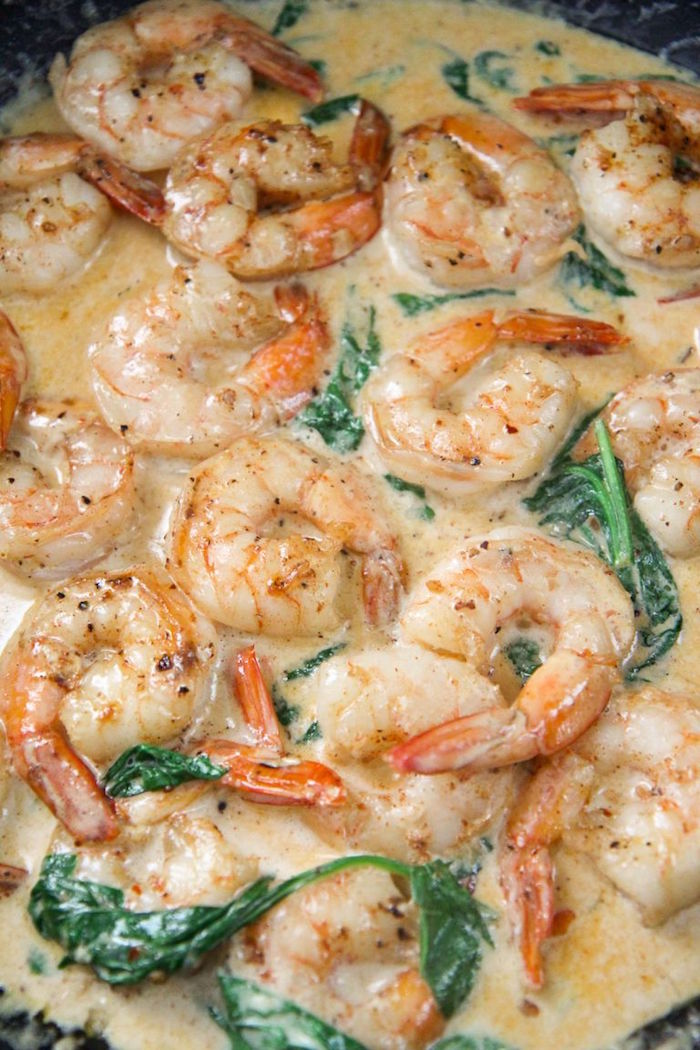 garlic butter shrimp in creamy sauce with spinach how long to cook shrimp close up photo inside the skillet