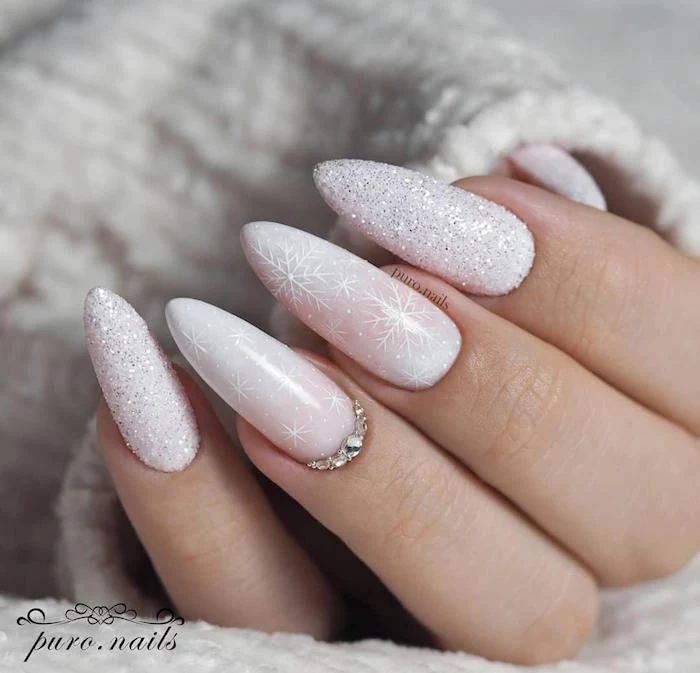 glitter ombre white nude nail polish christmas nail designs 2020 snowflake decorations and rhinestones on long almond nails