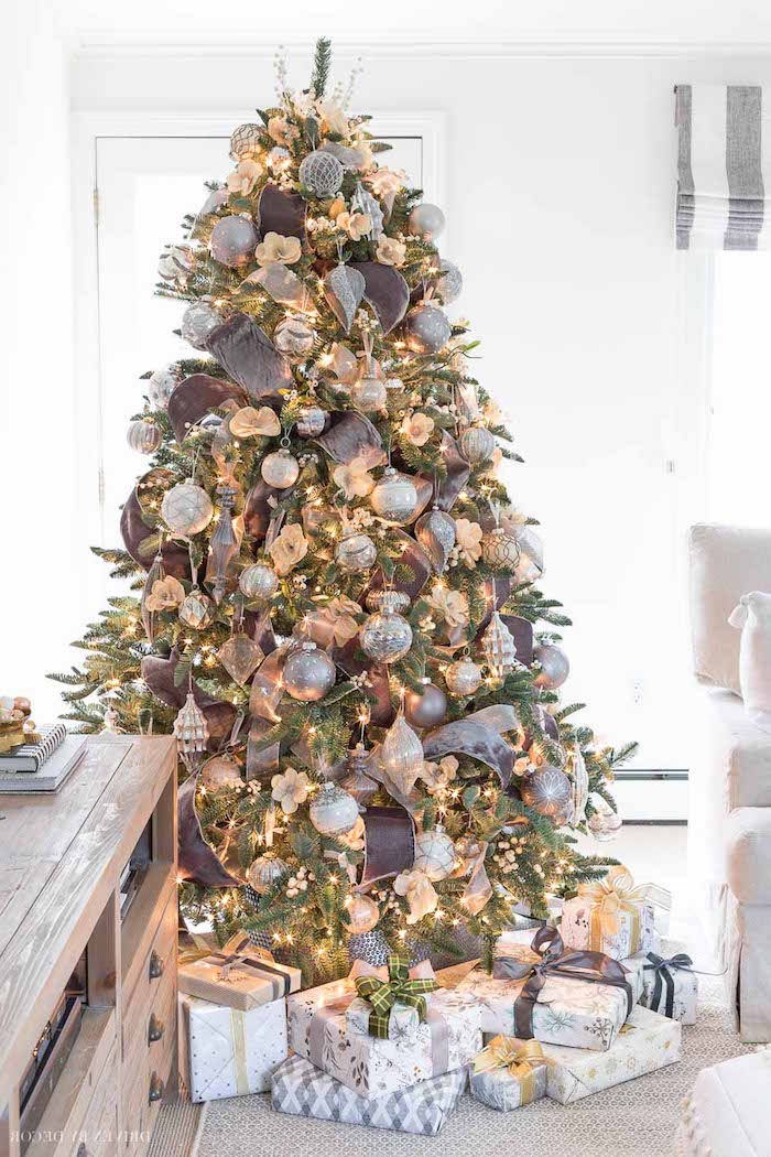 gray ribbon on real tree with silver gold baubles and ornaments presents underneath christmas tree decoration ideas