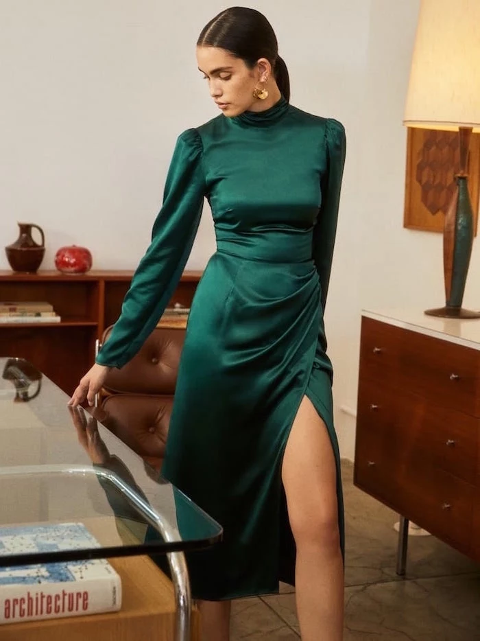 green satin dress with long sleeves worn by woman with long black hair in low ponytail semi formal dresses for wedding