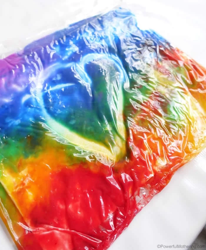 heart drawn into plastic bag filled with paint in all colors of the rainbow what to do on a rainy day