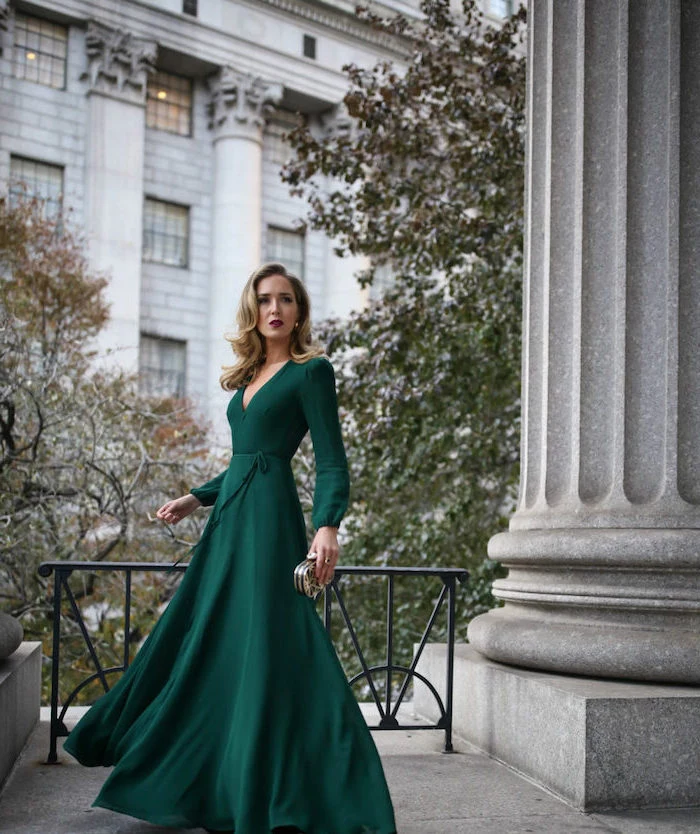 how to dress for a wedding blonde woman wearing long green dress with long sleeves v neckline