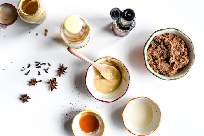 ingredients for ham glaze in small white bowls christmas dinner 2020 star anise placed on white surface