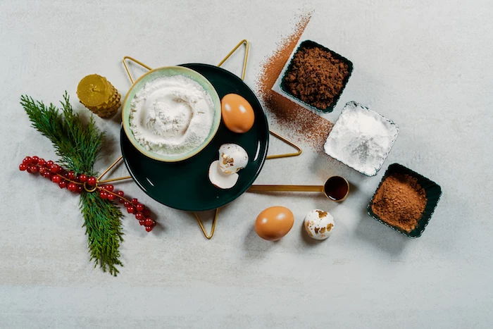 ingredients for yule log recipe easy christmas dinner ideas sugar flour eggs arranged on white surface