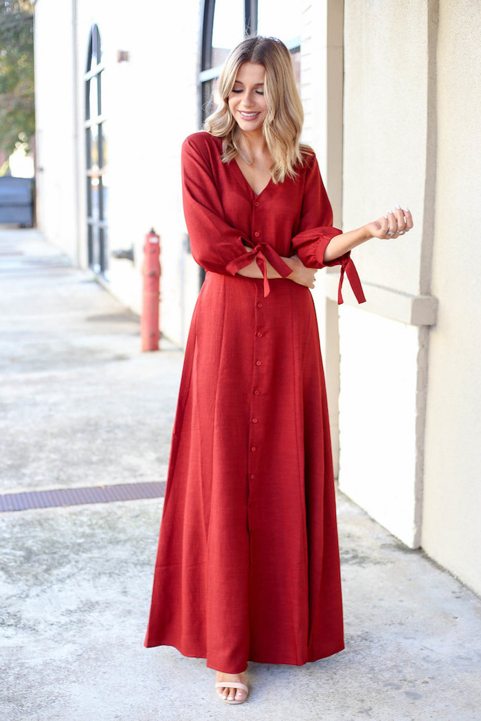 long red dress with long sleeves worn by woman with shoulder length blonde hair affordable wedding guest dresses nude sandals