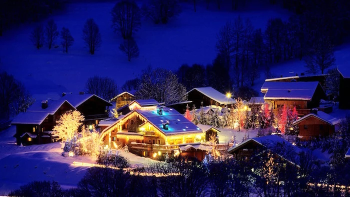 mountain village with houses covered with snow and lights christmas wallpaper iphone forest around it