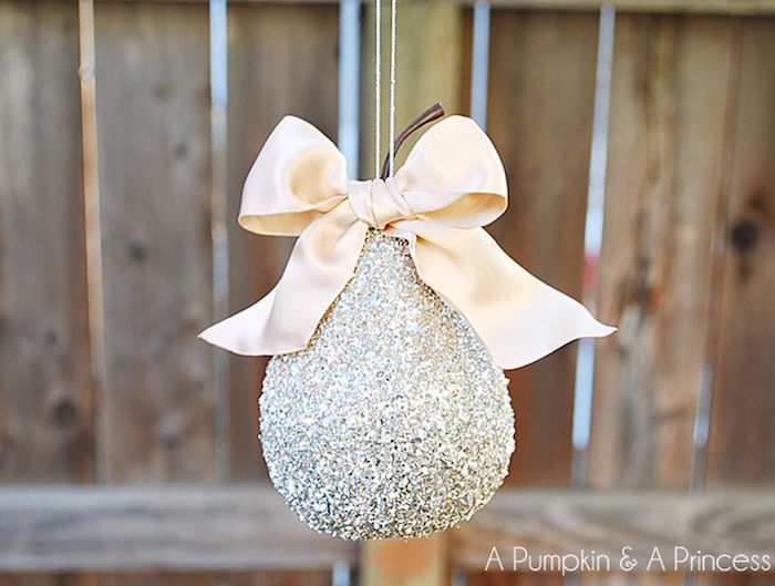 pear shaped ornament covered with silver glitter beige bow on top christmas tree decorations 2020 step by step diy tutorial