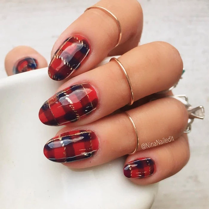 plaid decoration on each nail in red black and gold holiday nails 2020 medium length almond nails