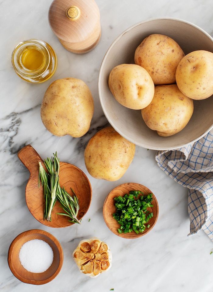 potatoes in a bowl garlic salt pepper rosemary olive oil thanksgiving vegetable side dishes mashed potatoes recipe