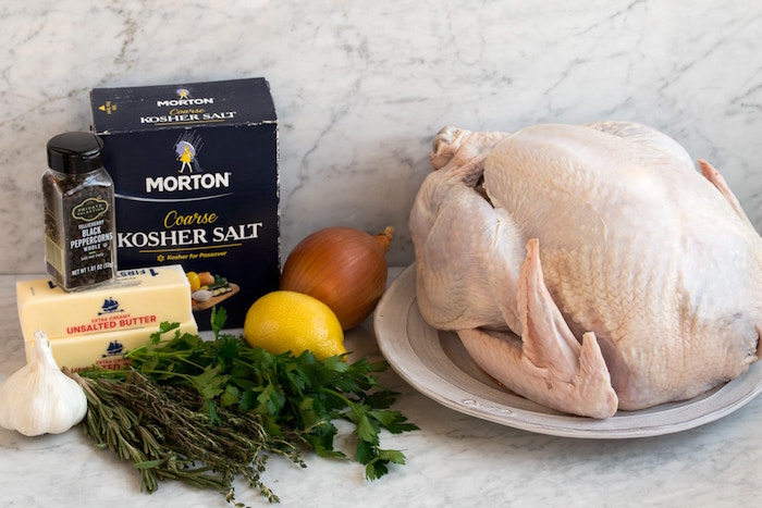 raw turkey butter salt black pepper onion garlic herbs easy christmas dinner ideas ingredients for roasted turkey