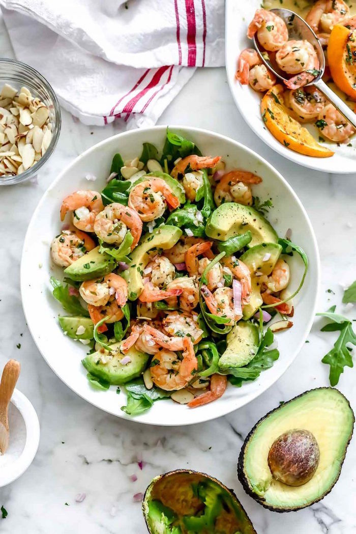shrimp salad recipe in white plate cooked shrimp recipes with avocado arugula silvered almonds onion