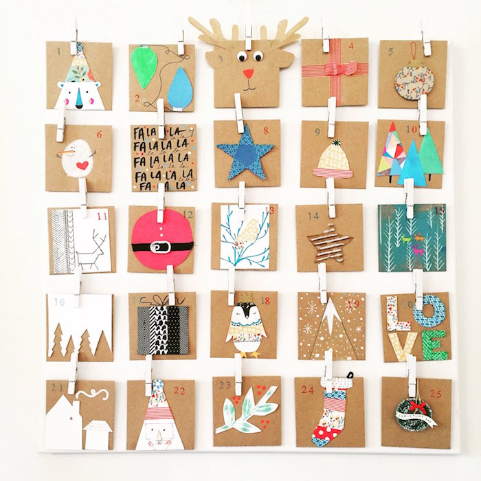 small cartons with different christmas themed decorations and numbers hanging on white wall fun advent calendars