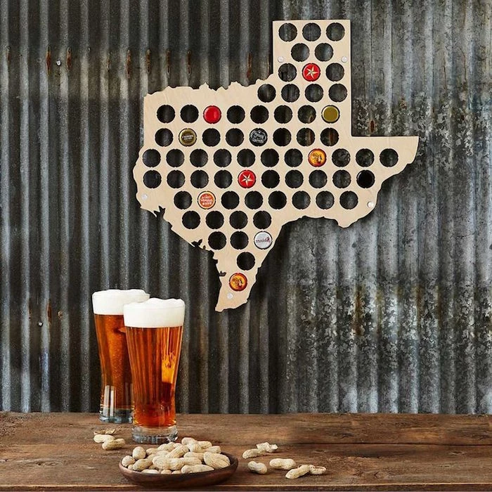 state map with holes which fit beer bottle caps gifts for dad from daughter two glasses of beer and peanuts placed on wooden floor