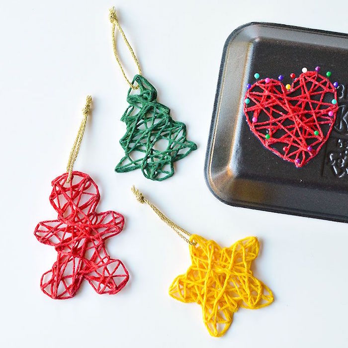 three ornaments made with green red yellow yarn how to decorate a christmas tree with ribbon step by step diy tutorial