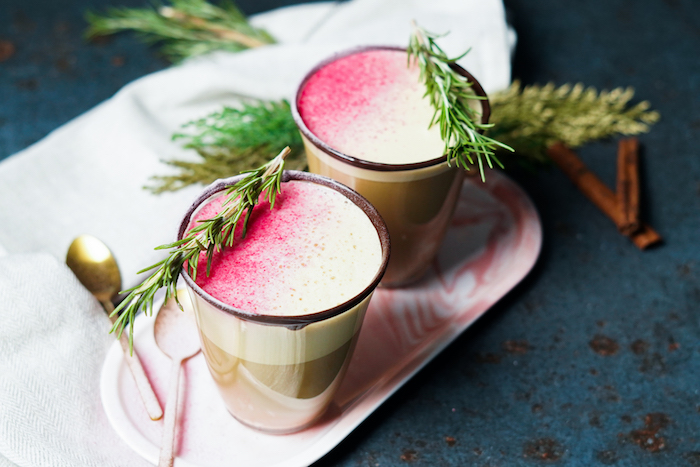 two glasses with chocolate on the rim alternative christmas dinner ideas filled with eggnog decorated with rosemary branches