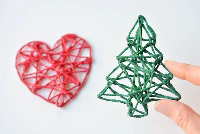 two ornaments made with yarn how to decorate a christmas tree with ribbon red heart shaped green tree shaped ornaments