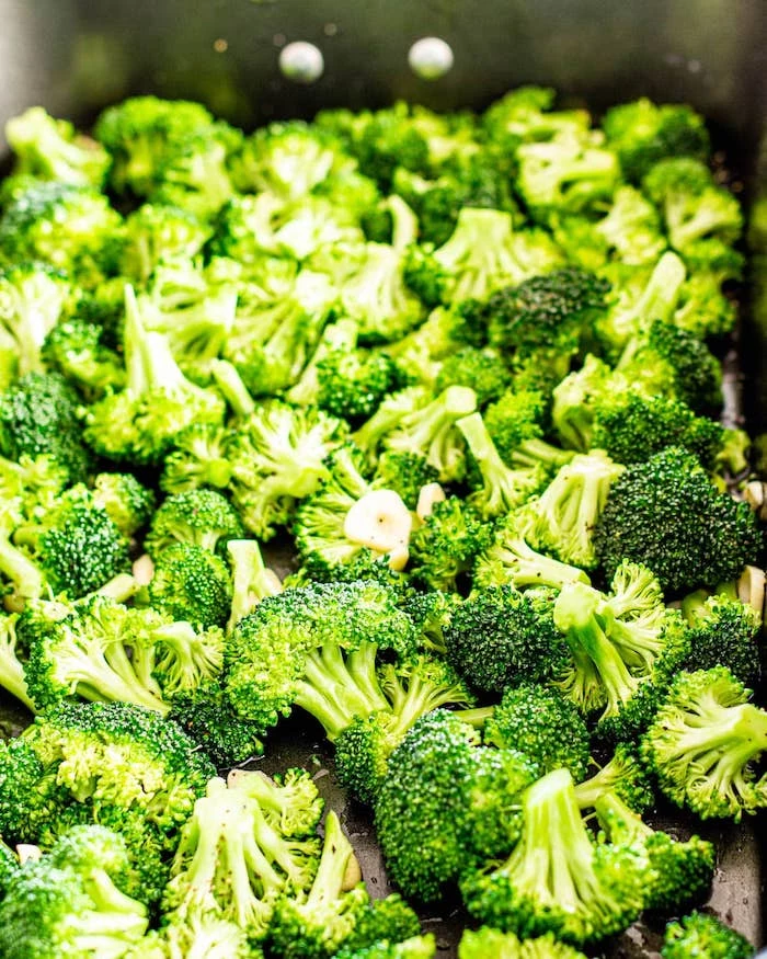 what to make on thanksgiving close up photo of lots of broccoli arranged in baking dish