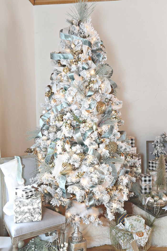 white tree with turquoise ribbon gold baubles small presents underneath christmas tree ideas 2020