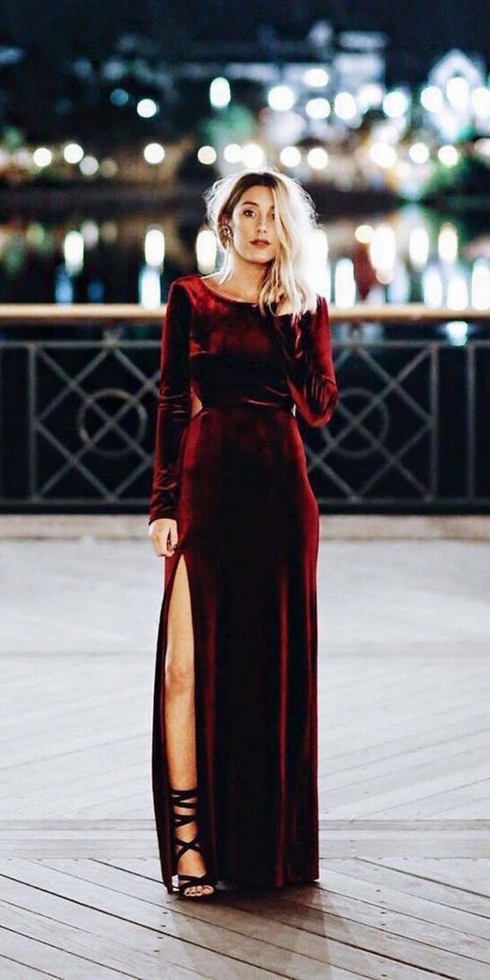 woman with blonde hair wearing long red velvet dress long sleeve wedding guest dresses black sandals