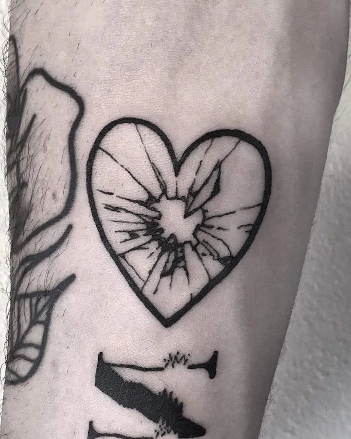 black heart outline inside made of glass shattered in the middle heart tattoo designs forearm tattoo