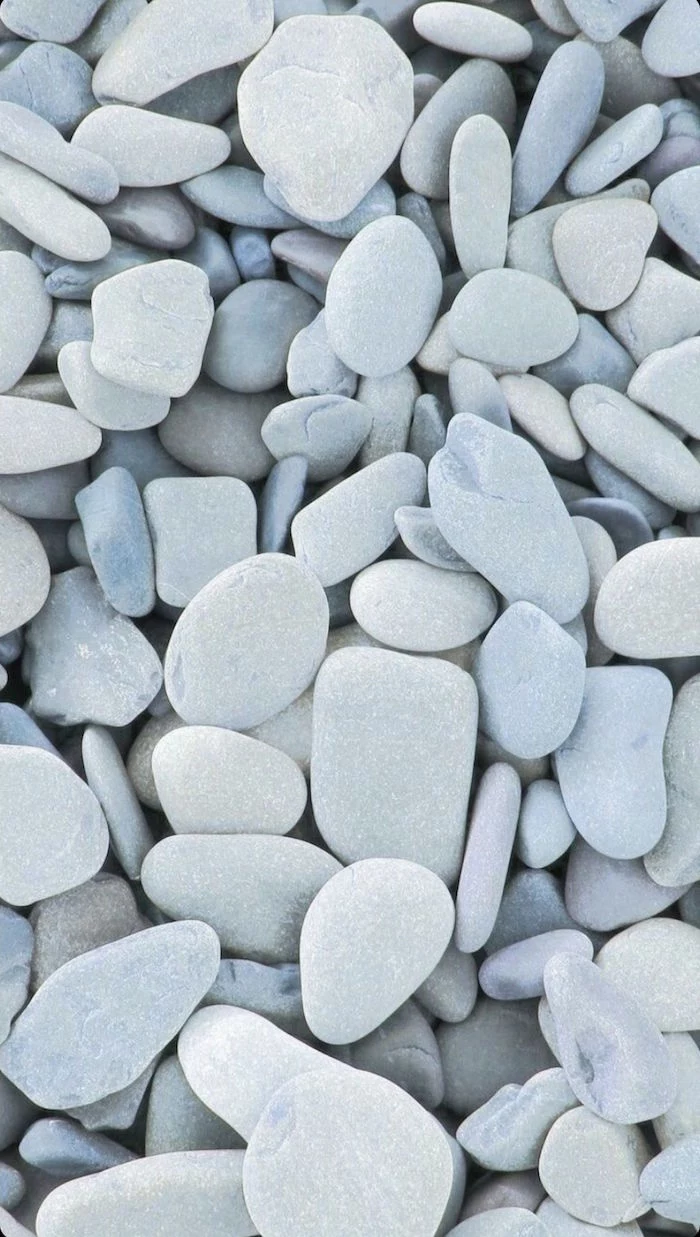 close up photo of lots of stones in different shapes minimalist aesthetic wallpaper different shades of gray
