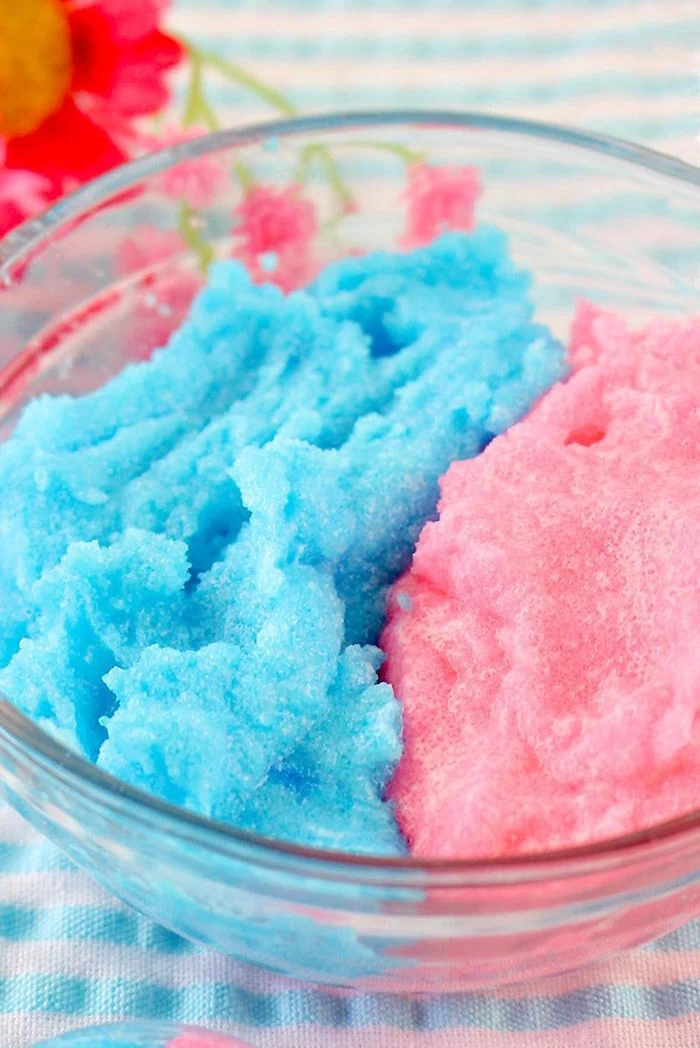 cotton candy lip scrub recipe dyed in pink and blue placed inside small glass bowl