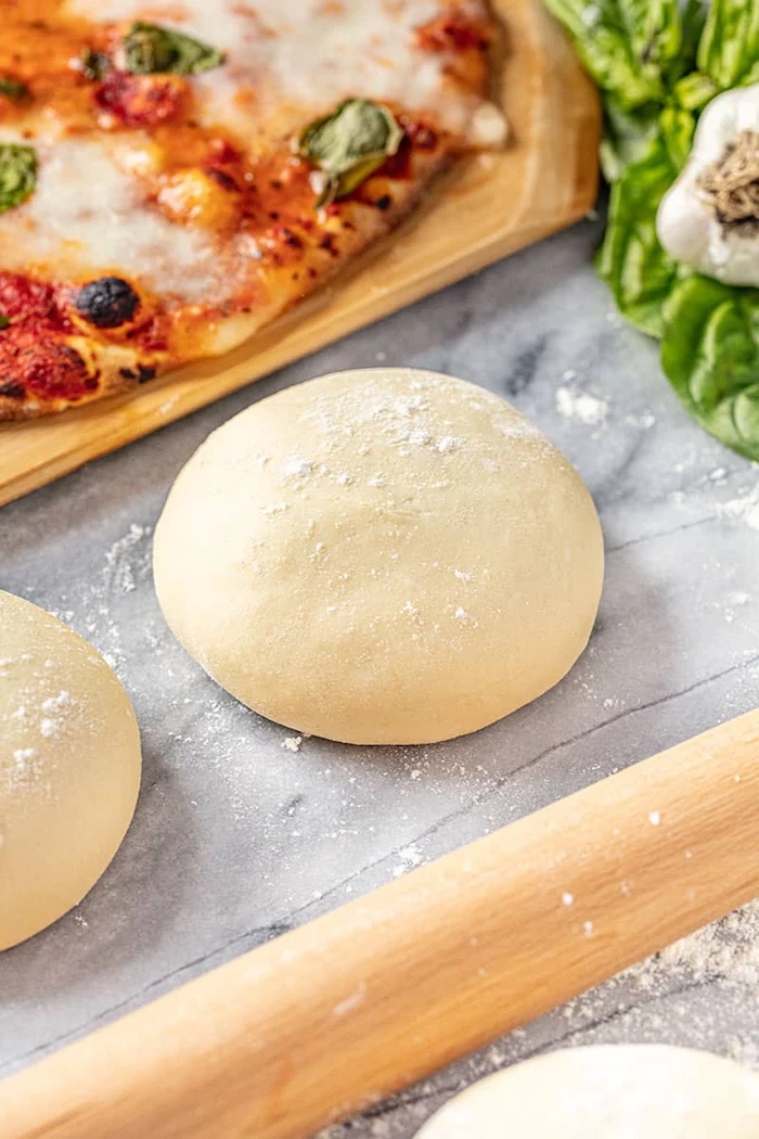 dough shaped into ball lightly floured placed on marble surface homemade pizza crust