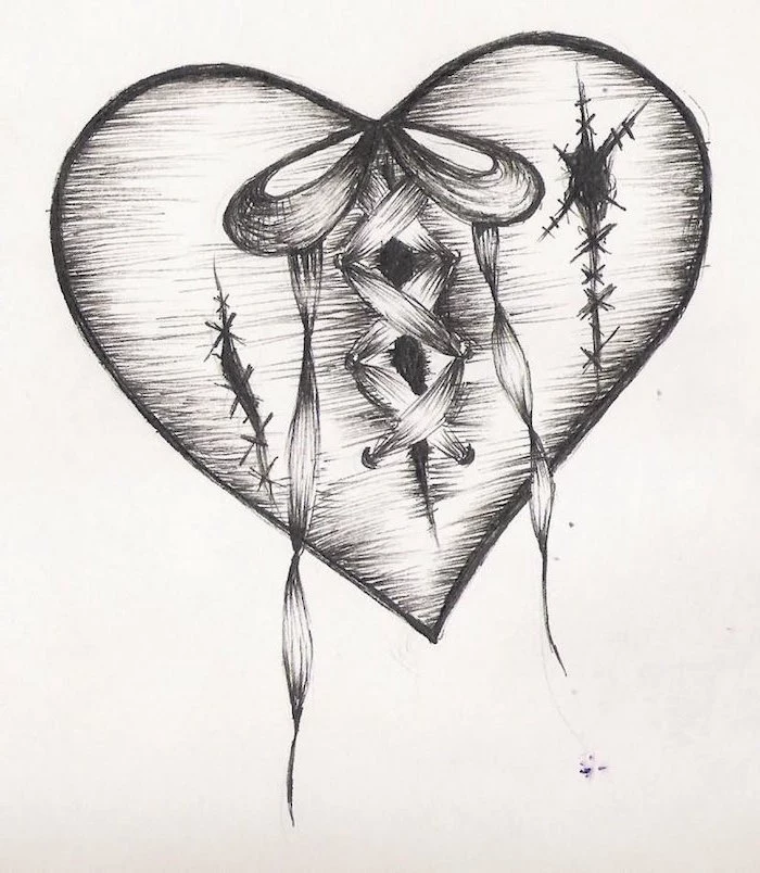 drawing of heart in black with stiches tied together in the middle with ribbon heart tattoo designs black and white drawing