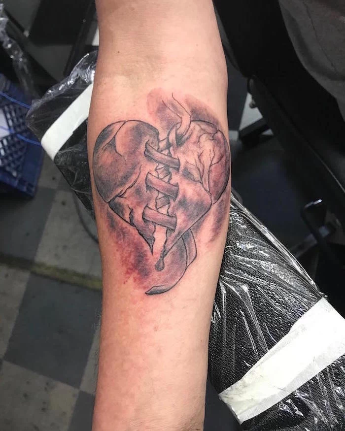 forearm tattoo heart tattoo on hand heart broken in the middle held together with bandages watercolor tattoo
