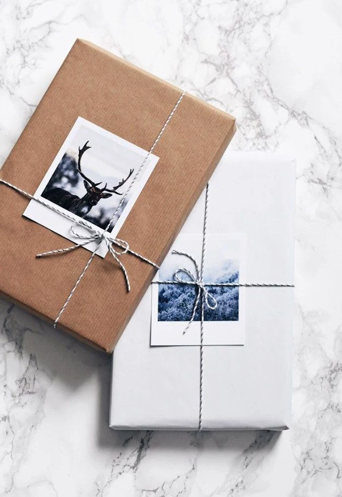 gift packing ideas two boxes wrapped in white and brown paper tied with small ribbons with two photos under the ribbons