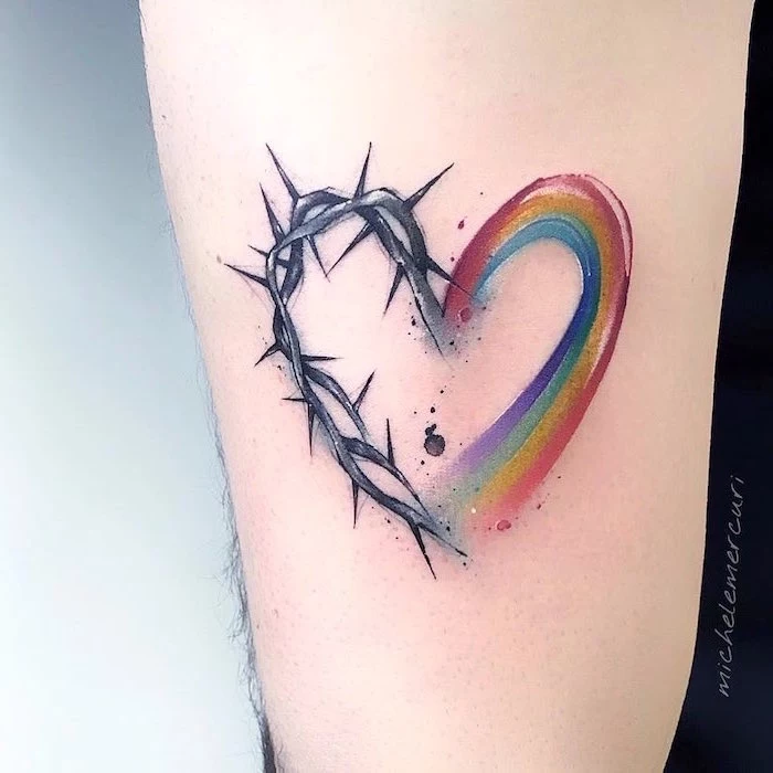 heart tattoo on chest forearm tattoo one half rainbow colors other half barbed wire watercolor tattoo